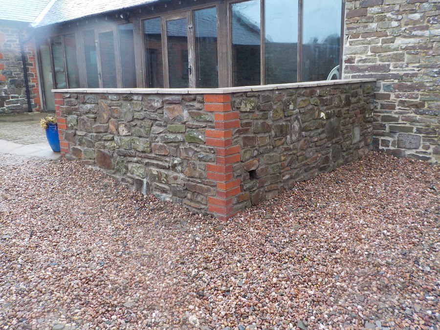 Patio extension with new stone wall