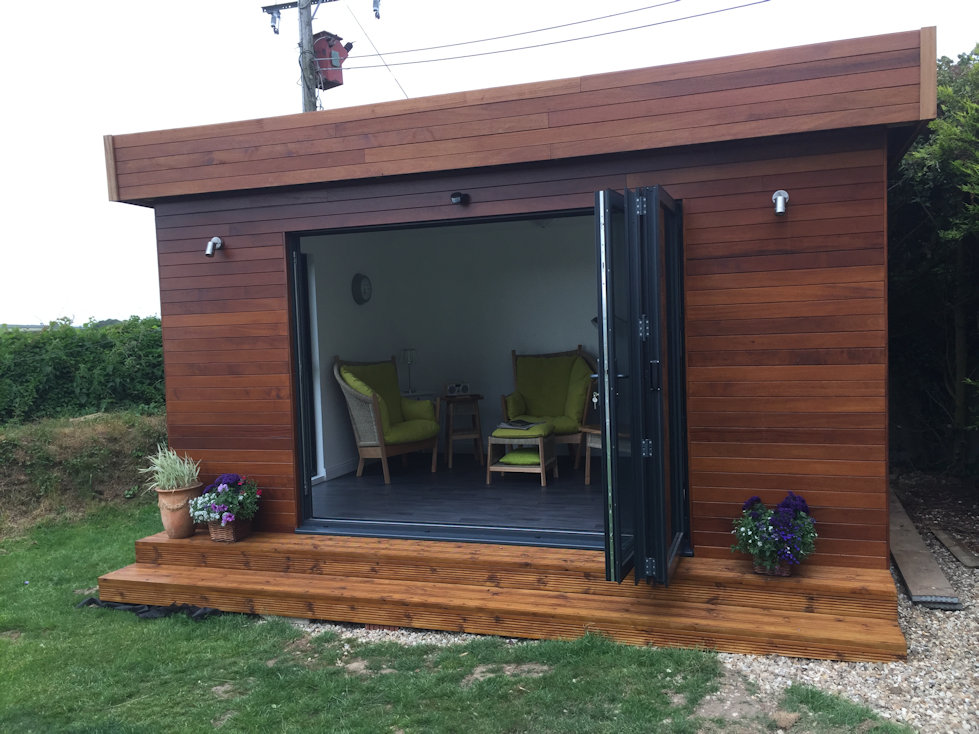 Garden room with bi-fold doors hard wood cladding and insulated