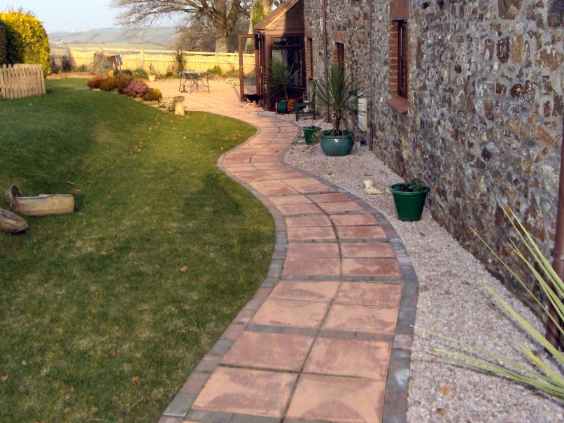 Paved pathway edged with brick.