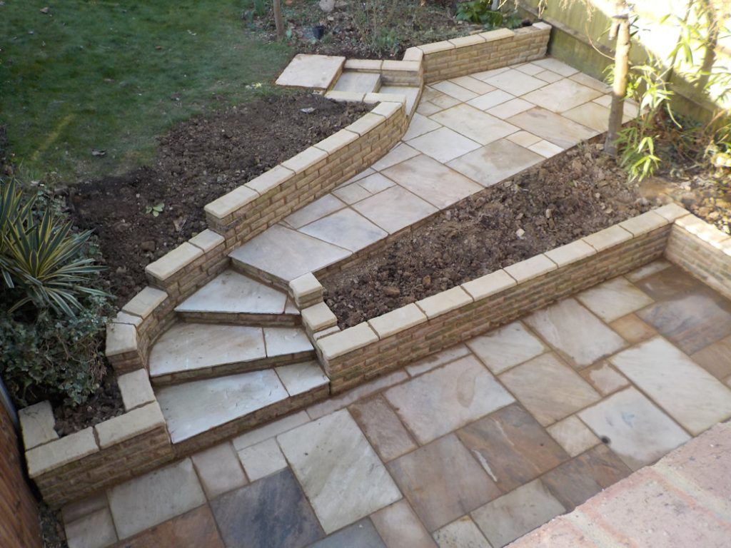 Patio, path and brick wall