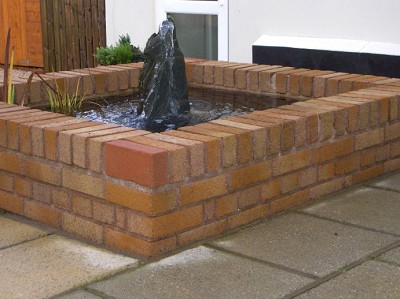Raised brick pond. by Your Garden Care