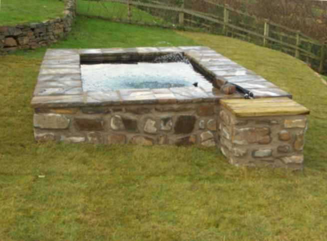 Raised stone pond.