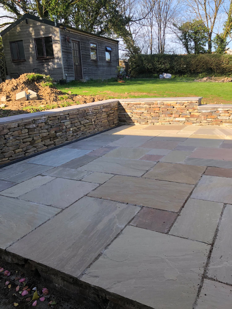 Photo of a Patio surrounded by a dry stone wall